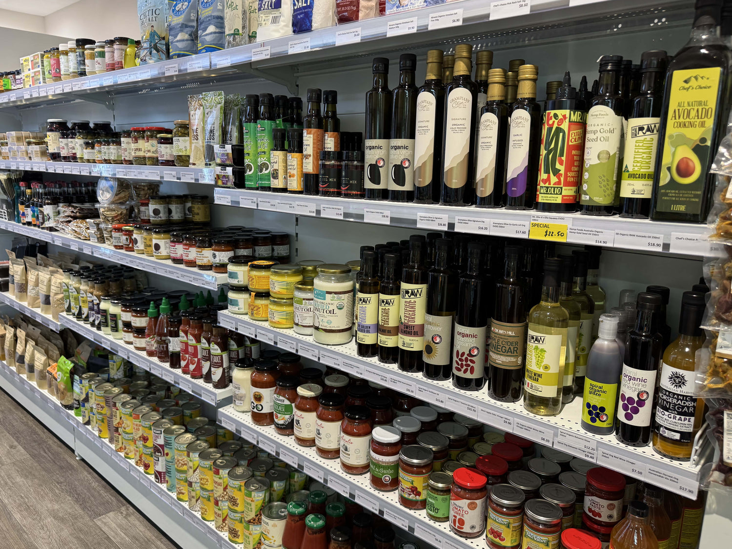 Shelves stocked with various bottles and jars in a store setting